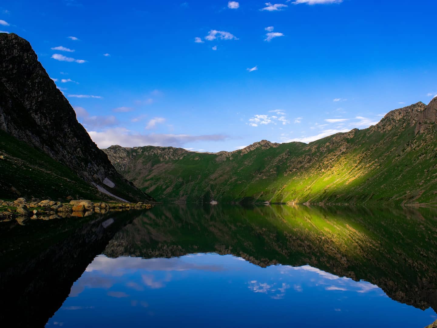 A sunrise over alpine lakes